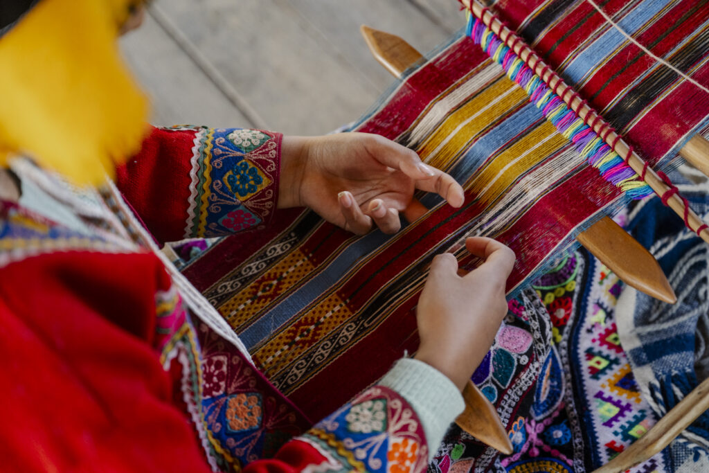 woman weaving tradition fabric at Mundo Alpaca in Arequipa Peru 