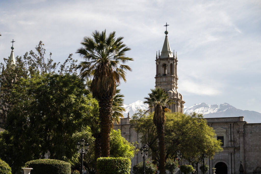 Tower of Basilica Cathedral of Arequipa with the Misti Volcano in the background