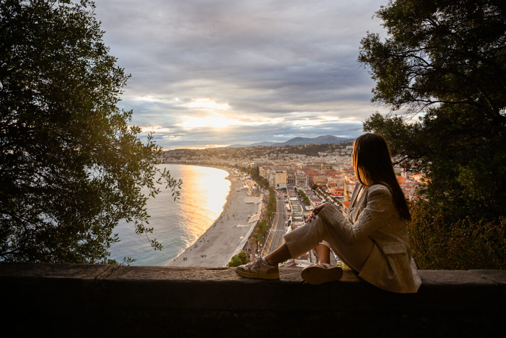 girl watching the sunset and view from castle hill in Nice, France